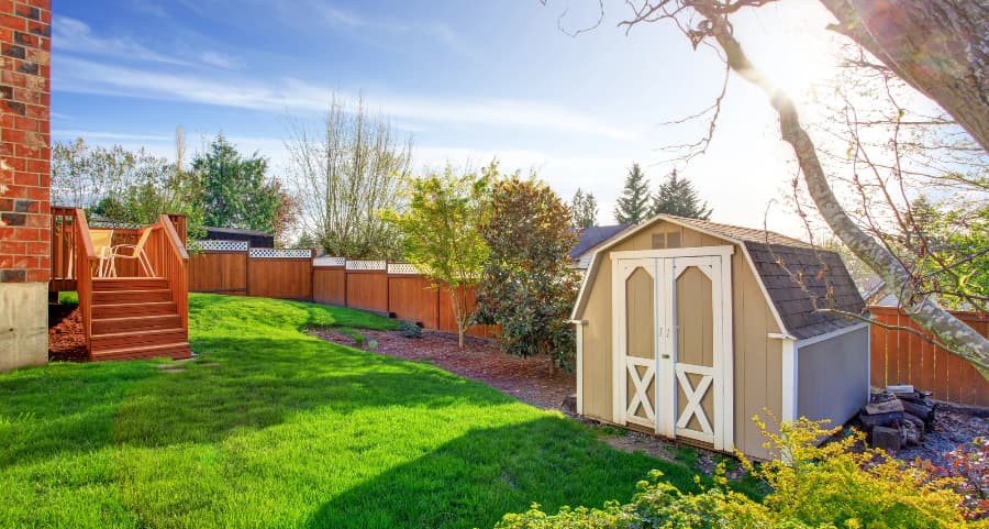 Fenced backyard with storage shed in Portland